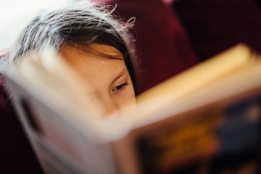 Beginner photographing with camera and notebook.