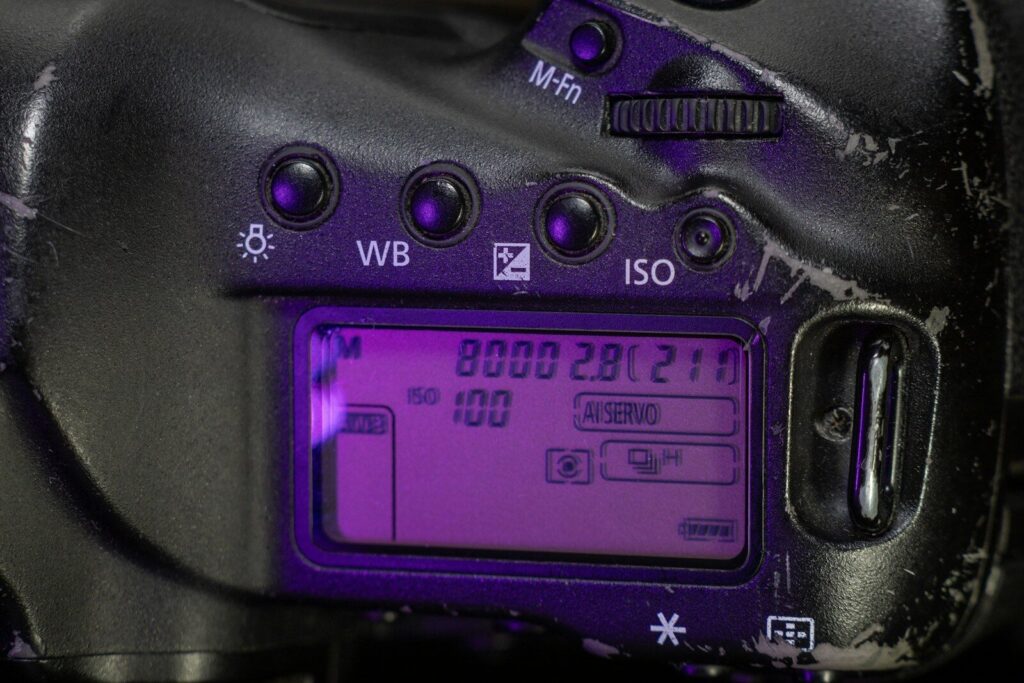 Camera with ISO settings in beautiful natural landscape.